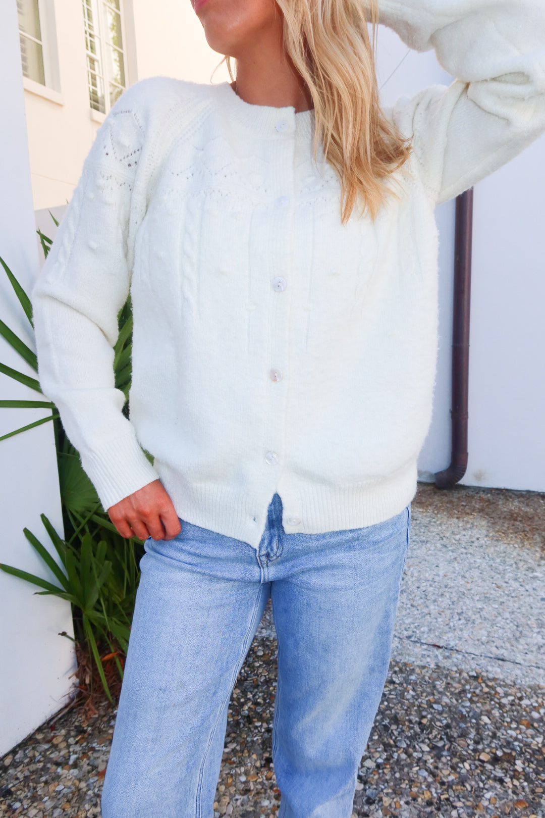 Cozy white knit cardigan designed